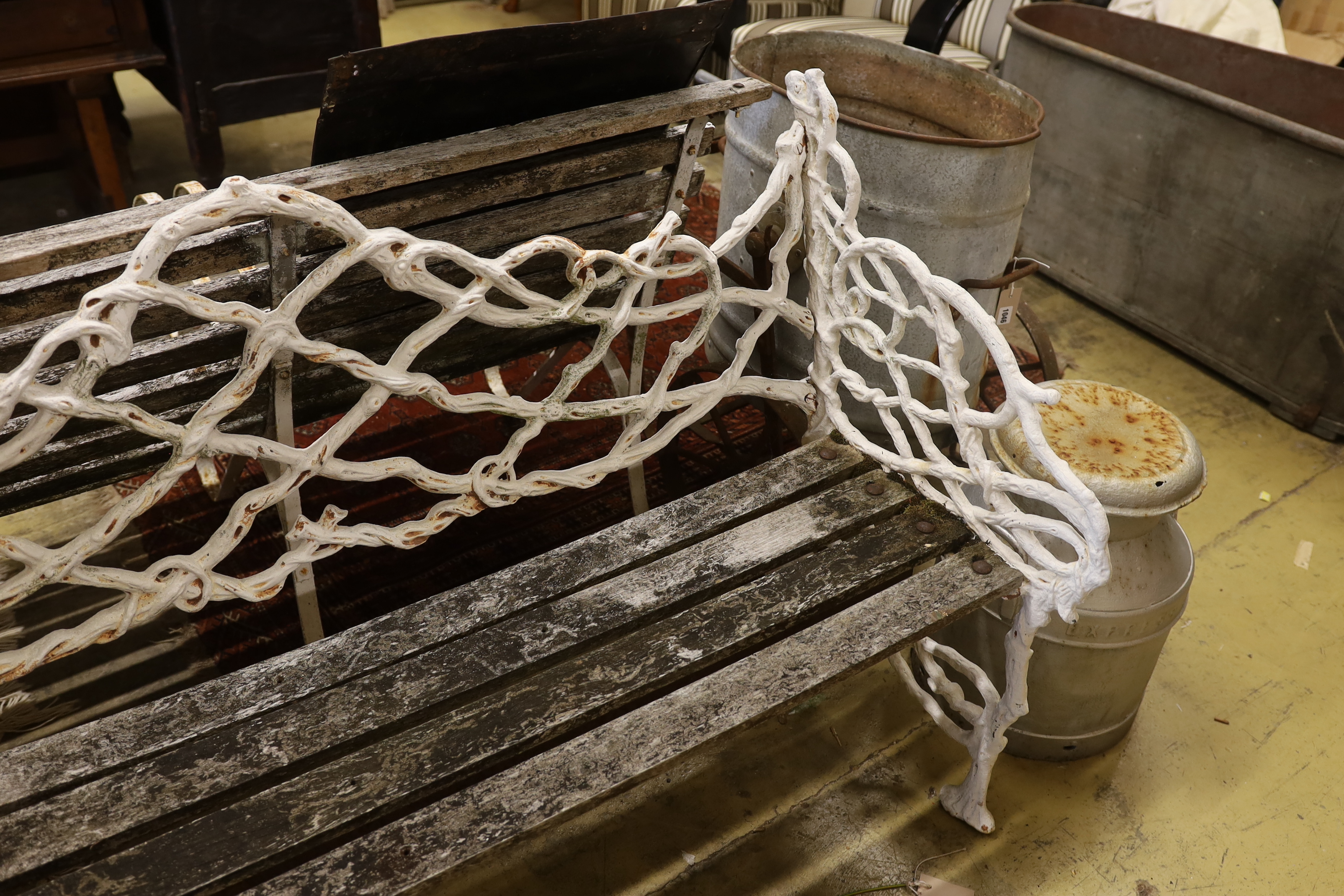 A Victorian Coalbrookdale design painted cast iron garden bench, length 138cm, depth 55cm, height 86cm